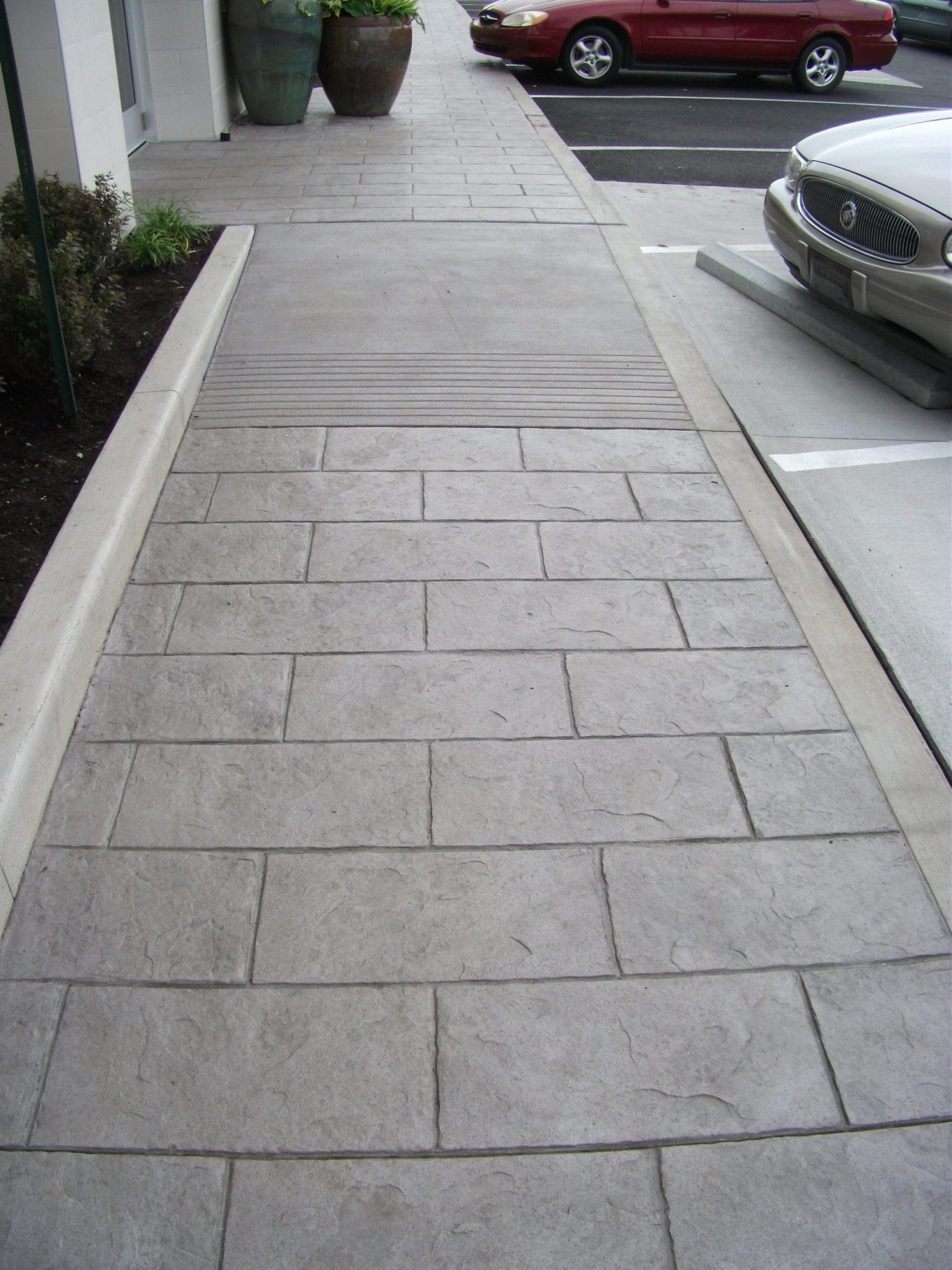 Decorative Colored Concrete Stains And Colors Surecrete Products   Commercial Brow Stained Walkway 